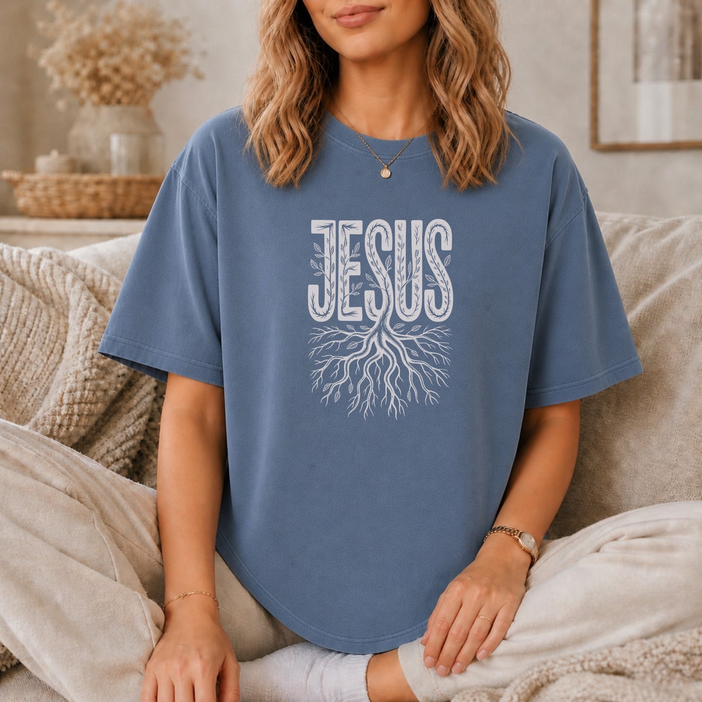 Blue t-shirt with "Jesus" text and tree root design.