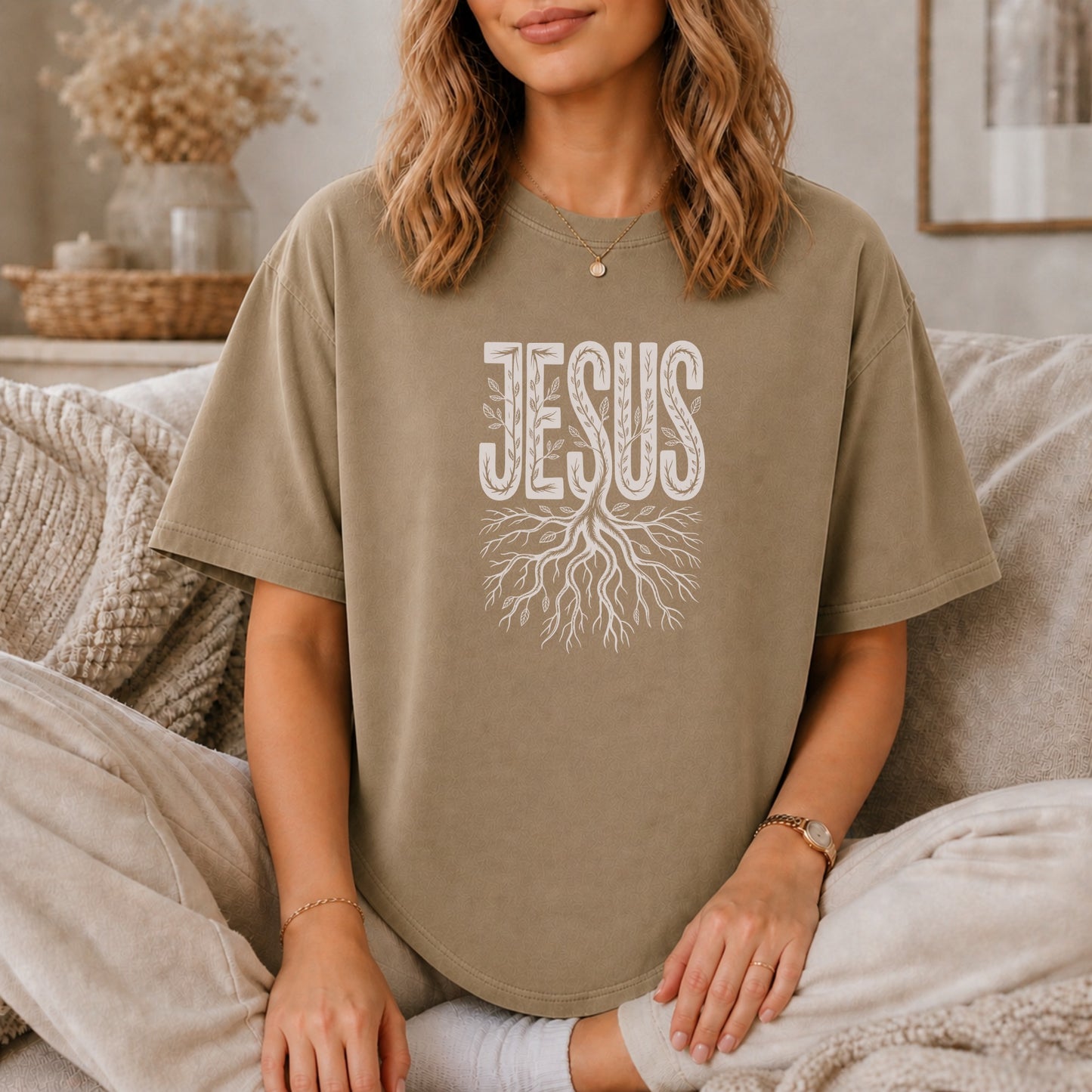 Brown t-shirt with white "Jesus" text over a tree root design.