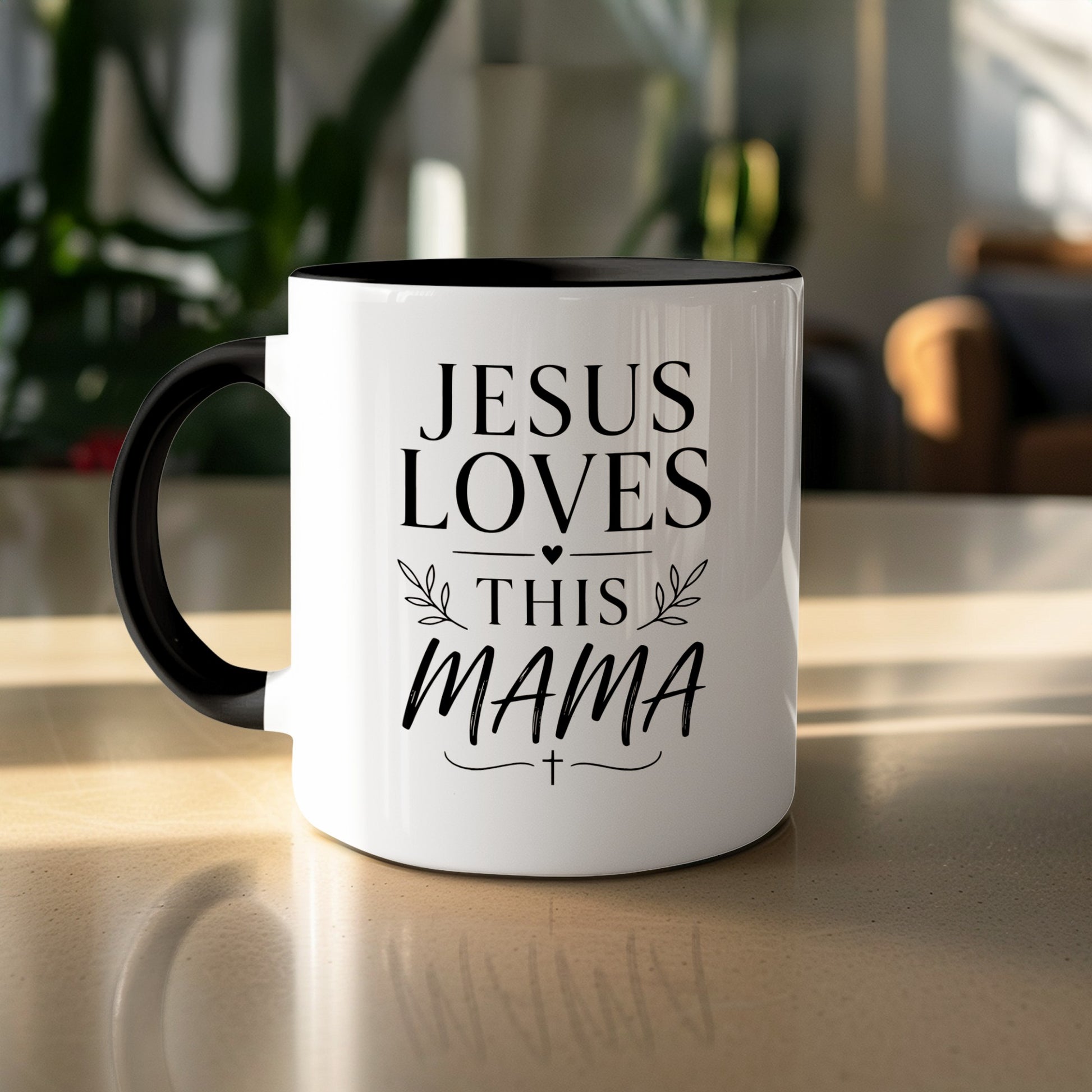 White mug with black handle, featuring "JESUS LOVES THIS MAMA" text.