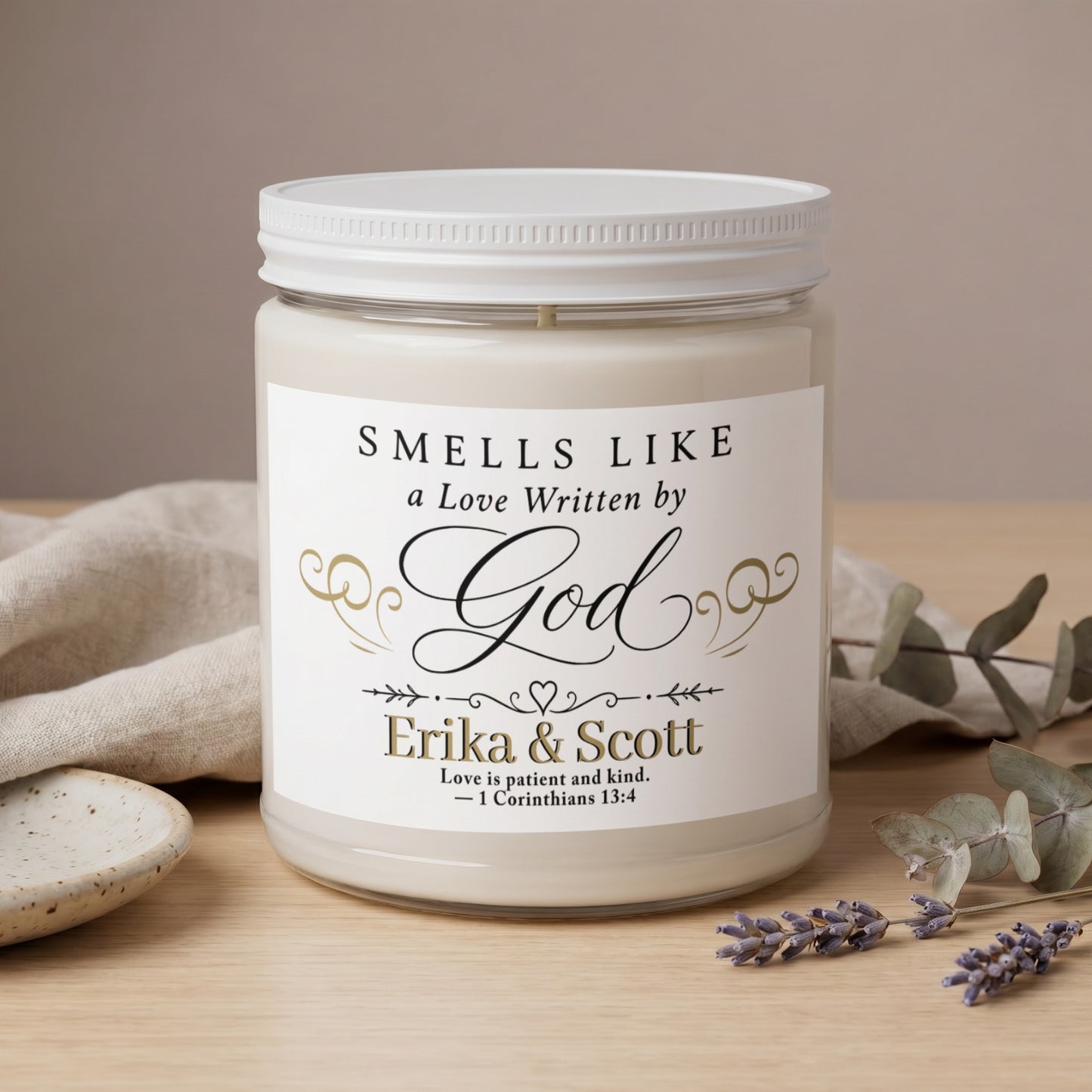 Candle with text "Smells Like a Love Written by God" and names Erika & Scott.