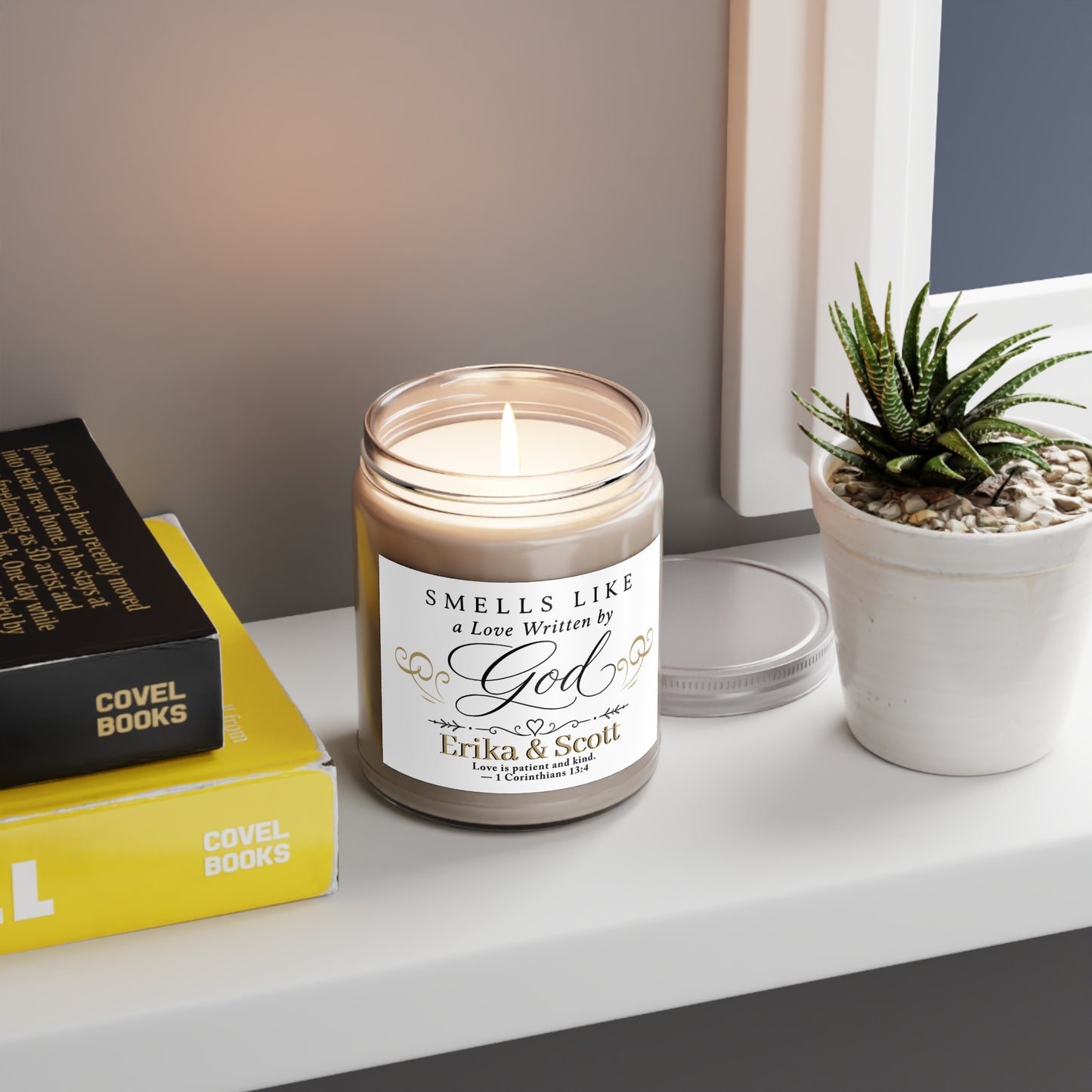 Scented candle with "SMELLS LIKE a Love Written by God Erika & Scott" text.