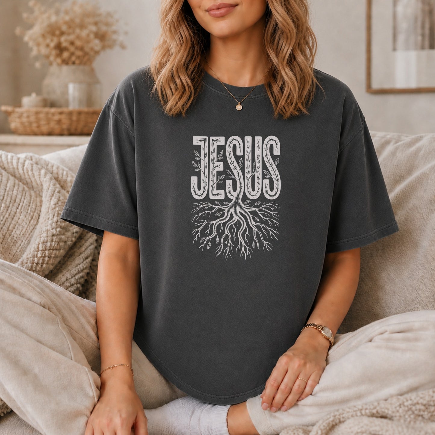 Dark grey t-shirt with "JESUS" text and tree roots design.