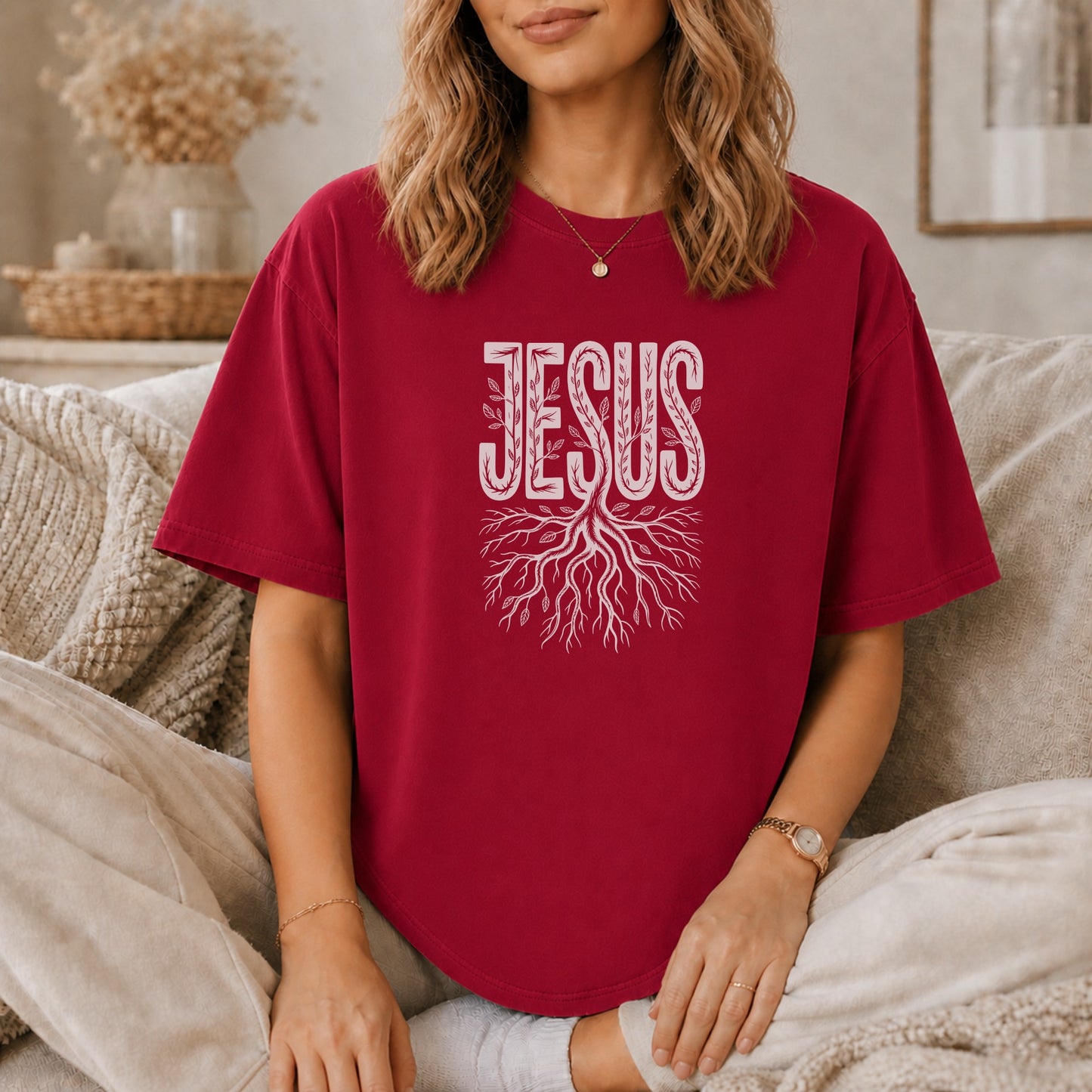 Dark red t-shirt with "JESUS" text above a tree root design.